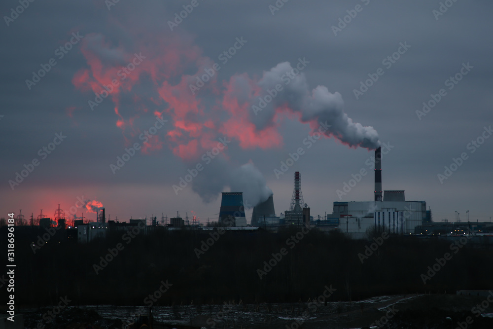 Sunrise over a power plant