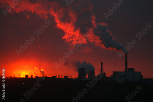 Beautiful sunrise over a power plant. Ecology problems. Environmental pollution.