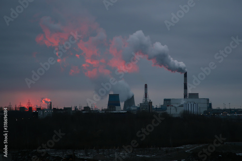 Sunrise over a power plant