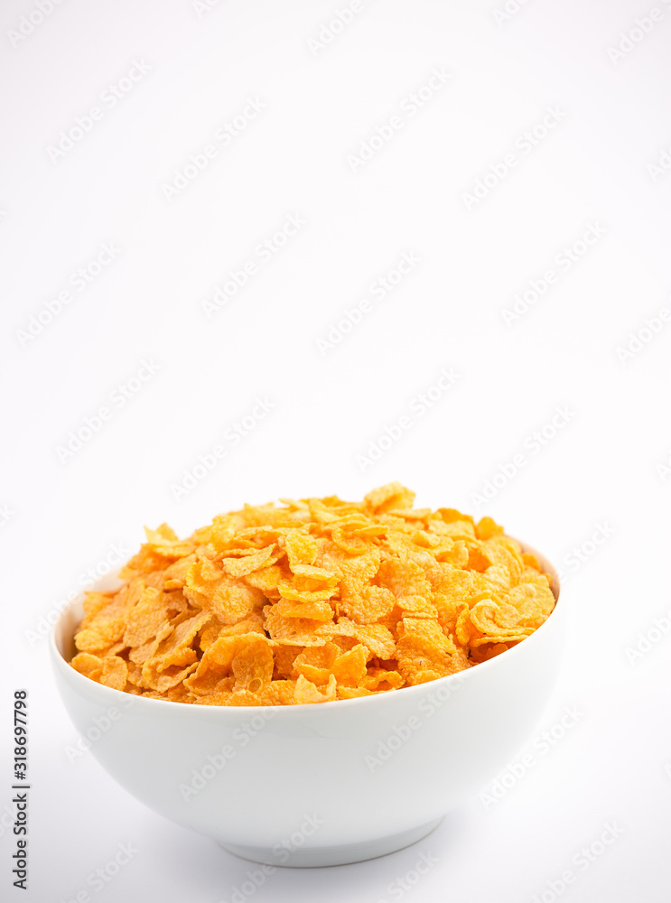 Natural corn flake breakfast cereal in cups and milk is a healthy breakfast that is good for your body every day on a white background. Natural corn flake breakfast cereal in cups and milk is a healthy breakfast that is good for your body every day on a white background.