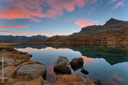 Sunset on the Muffè Lake in the park Mont Avic in Aosta Valley, Italy.