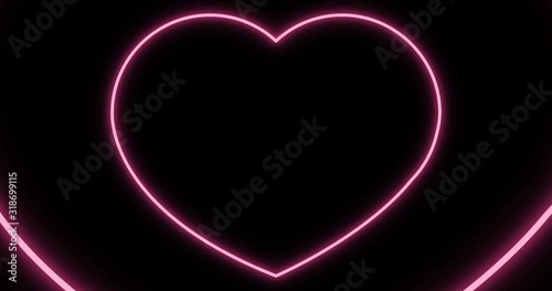 Pink neon heart.Valentine on black background.