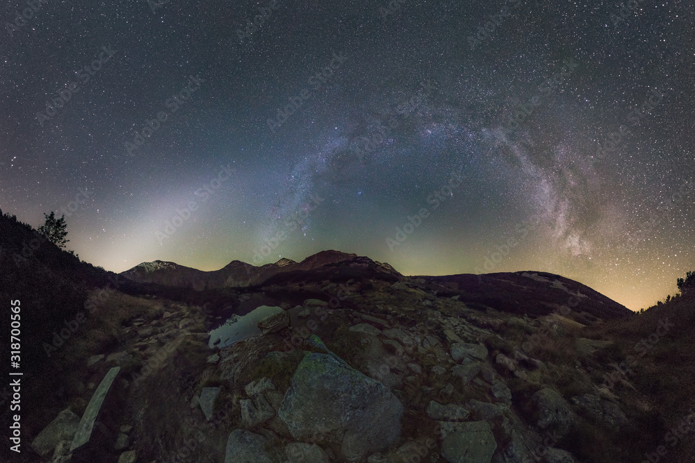 Zodiacal Light and Milky Way Over Mountain Landscape