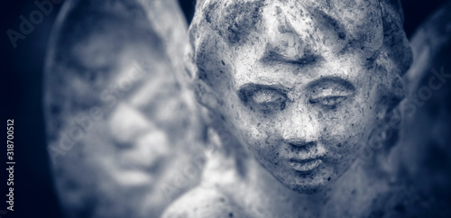 Vintage image of a sad angel. Rreligion and death concept. photo