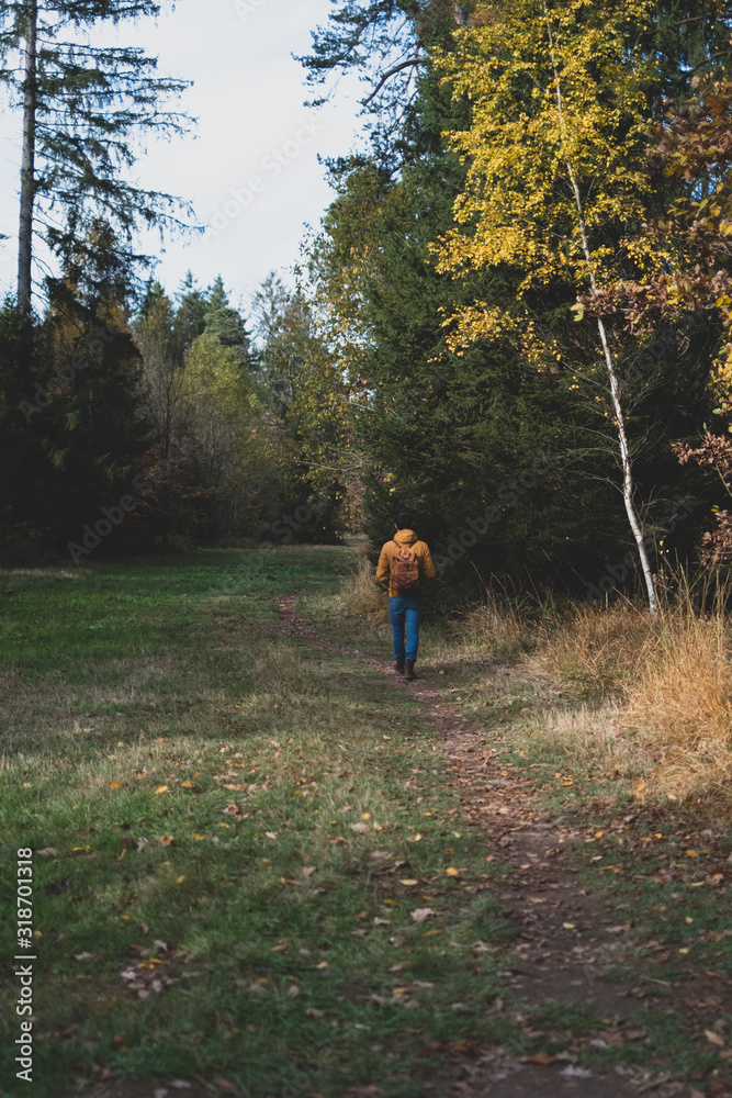 man running in autumn forest man running in autumn forest