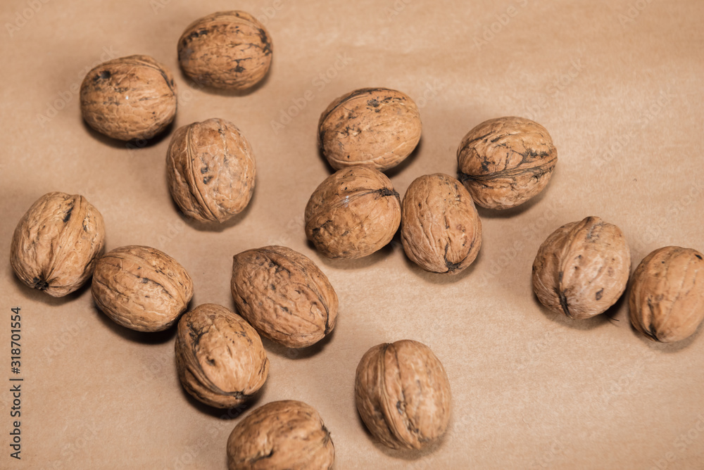 walnuts in the shell on wooden background walnuts in the shell on wooden background