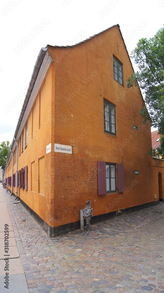 COPENHAGEN, DENMARK - JUL 06th, 2015: Nyboders Mindestuer Museum - yellow historical buldings in Old Town of Copenhagen and former naval barracks
