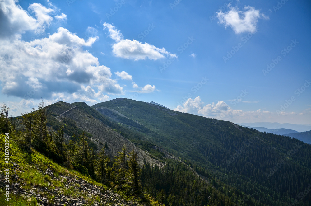Mountain landscape with hiking trail and view of beautiful ridge, Carpathian mounts, Gorgany, Ukraine.