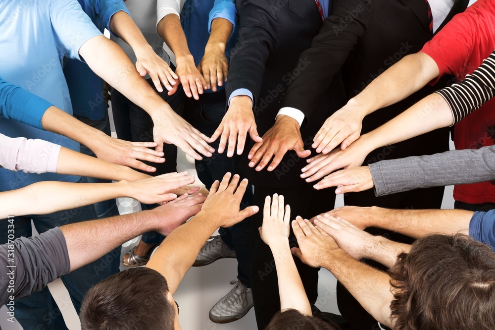 Hands of many young business people in the circle Hands of many young business people in the circle