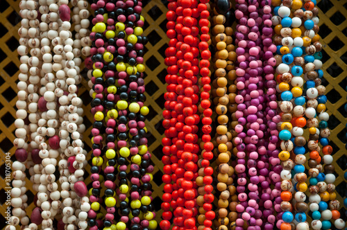 Brightly colored beaded necklaces representing the spirits of Candomble, the Afro-Brazilian religion, hanging in Pelourinho, Salvador, Bahia, Brazil  photo