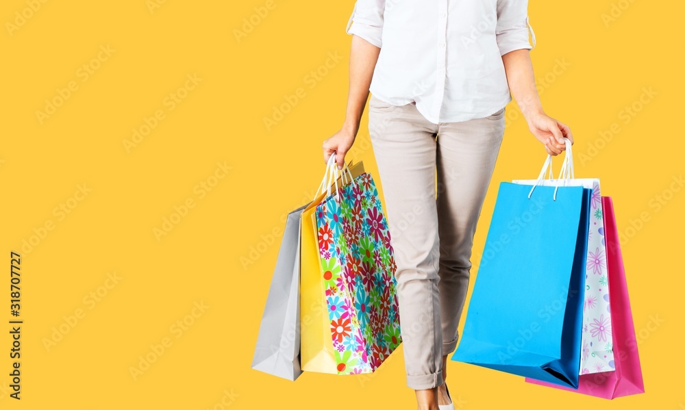 Young woman with colored shopping bags