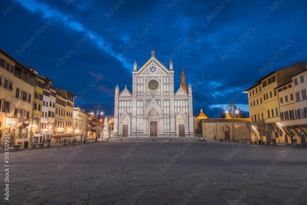 Church of Santa Croce in Florence in Tuscany in Italy during blue hour with empty square and historical old buildings