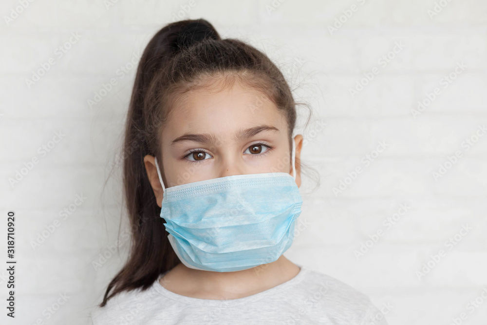 Child in a sterile medical mask. Sick little girl. Epidemic of flu. Virus, coronavirus. Child in a sterile medical mask. Sick little girl. Epidemic of flu. Virus, coronavirus.