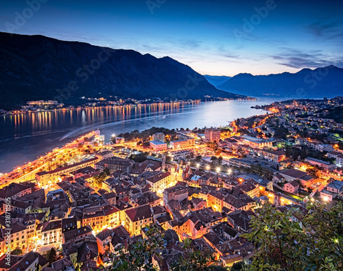 View on Kotor Bay with the medieval castle and with ships at night © Horváth Botond