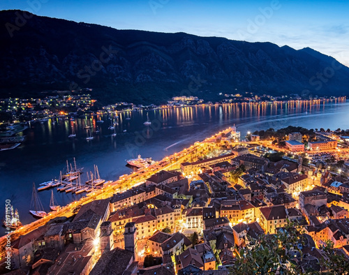 View on Kotor Bay with the medieval castle and with ships at night
