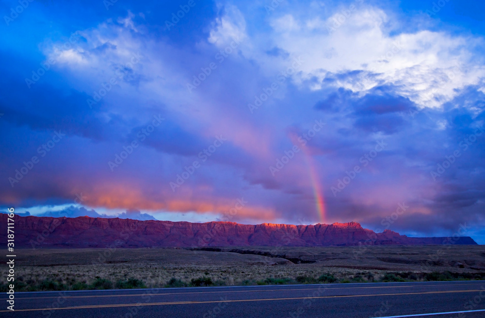 Sunset Rainbow Over Vermilion Cliffs In Arizona