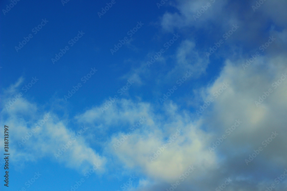 Blurred image of blue sky and clouds. Beautiful landscape background, copy space for text.