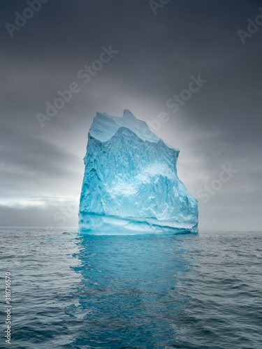 alone iceberg under clouds © sergejson