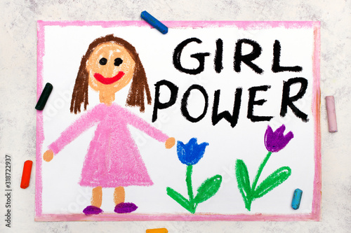 Photo of colorful drawing: Smiling young woman and hand drawn lettering phrase GIRL POWER