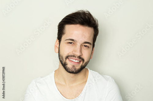 Handsome smiling man with white teeth