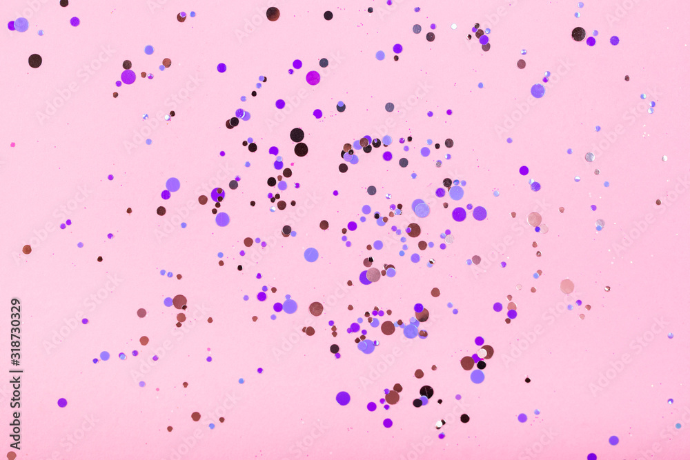 Falling confetti on bright background. Holiday and party concept.