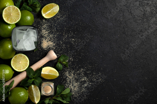 process of making homemade cocktail, flat with the ingredients for mojito on a black background, a refreshing summer cocktail