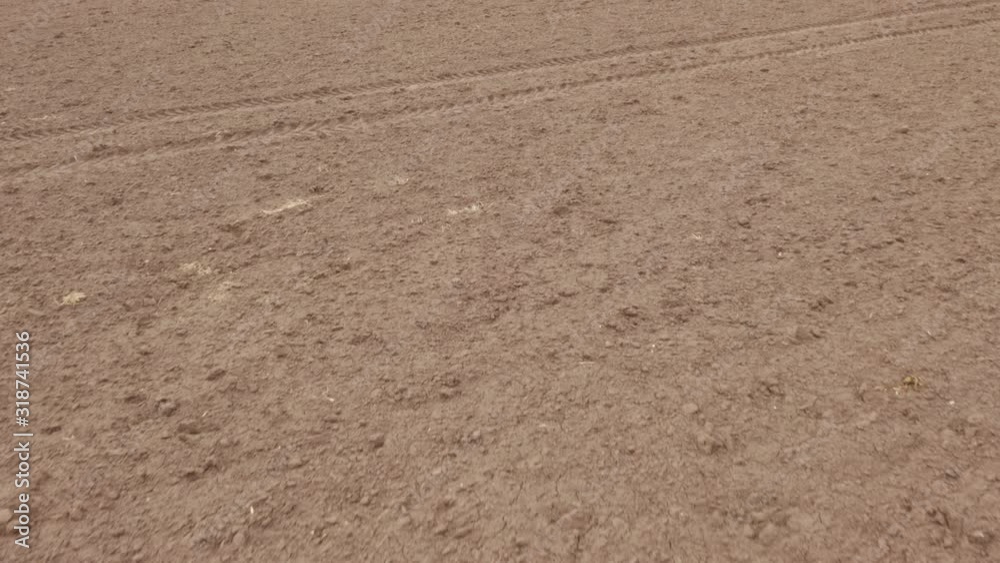 Aerial survey of land, farm field. Dirt.