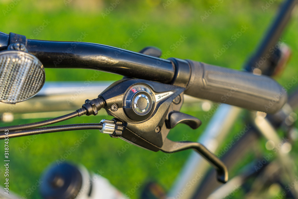 Bicycle handle bar with a break lever closeup Bicycle handle bar with a break lever closeup