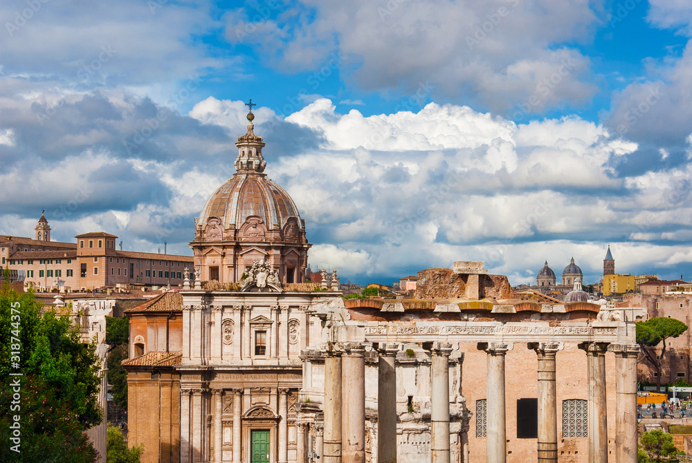 View of Rome historic center skyline from Capitoline Hill, with ancient ruins and baroque domes