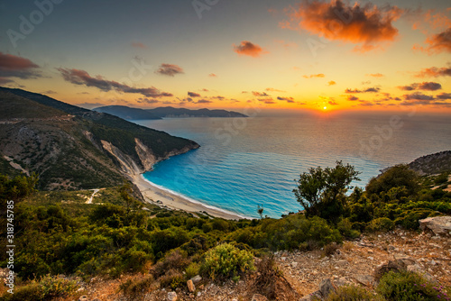 Fototapeta Naklejka Na Ścianę i Meble -  Beautiful summer sunset on Mirtos beach in Greece