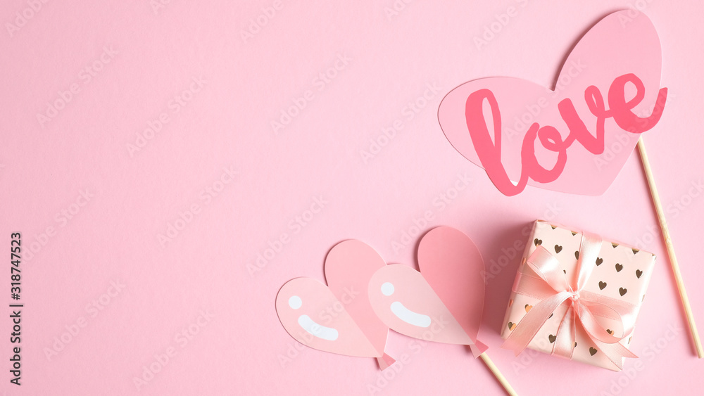 Valentines Day banner template. Gifts and Valentine's Day hearts decorations on pink background with copy space. Creative design for party invitation, greeting card. Love and romance concept.