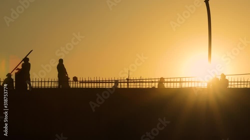 Silhouette construction working in  construction site  during sunset