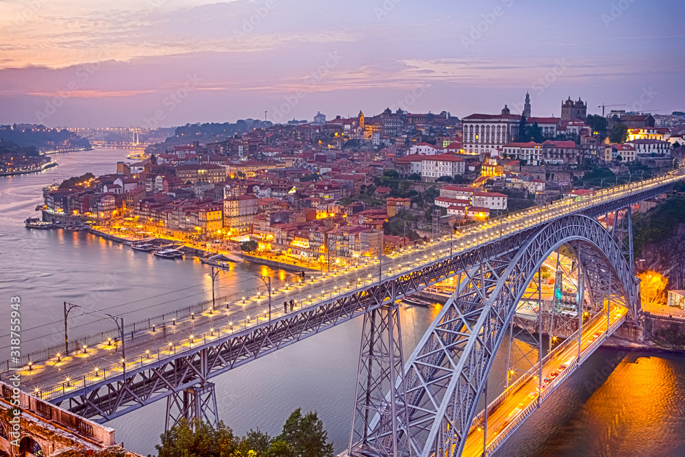 Travel Concepts. Dom Luis I Bridge in Porto in Portugal During Golden Hour With Passing Metro Lanes.