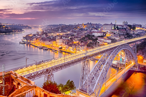 Travel Concepts and Ideas. Dom Luis I Bridge in Porto in Portugal During Golden Hour With Passing Trains.