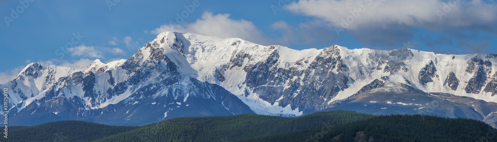 Snow-covered mountain range, panorama nature, Altai. Travel and vacation in the mountains.