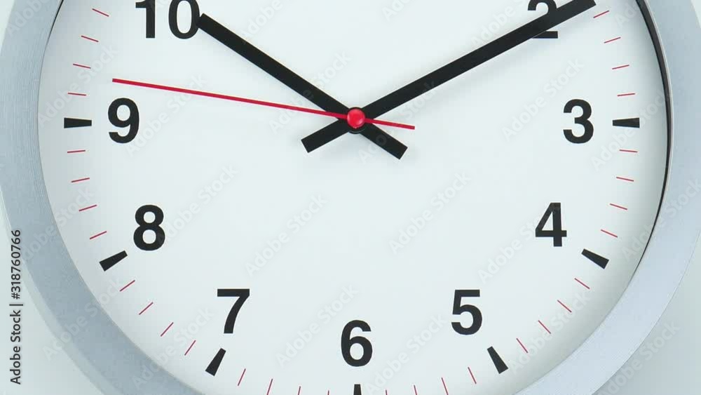Closeup White Gray wall clock face beginning of time 10.11 am or pm. on white background, Time concept. Closeup White Gray wall clock face beginning of time 10.11 am or pm. on white background, Time concept.