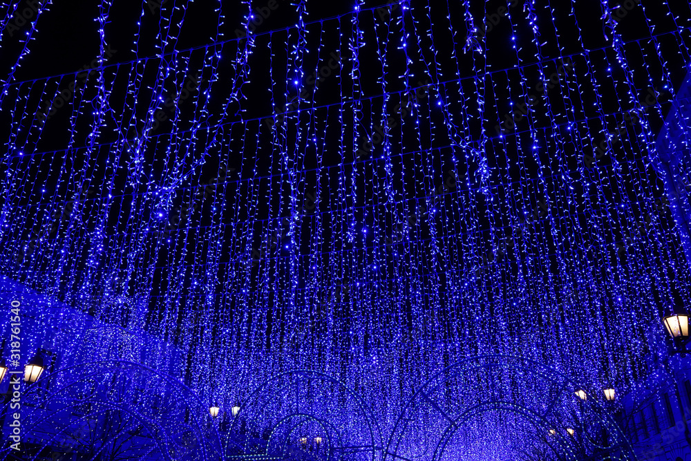 Fototapeta Night landscape with blue holiday illumination