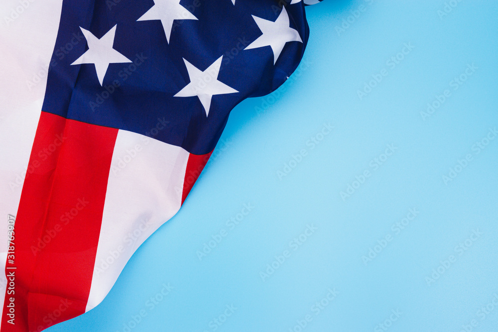 US American flag on blue background. For USA Memorial day, Memorial day, Presidents day, Veterans day, Labor day, Independence day, or 4th of July celebration. Top view, copy space for text. US American flag on blue background. For USA Memorial day, Memorial day, Presidents day, Veterans day, Labor day, Independence day, or 4th of July celebration. Top view, copy space for text.