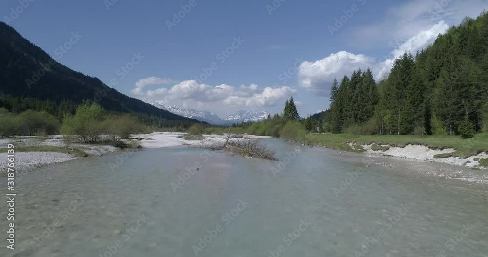 Flight along riverbed in the mountains, Bavaria, Germany