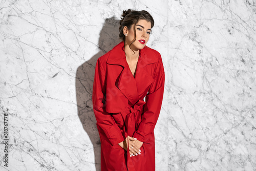 Model dressed in fashionable clothes posing indoors