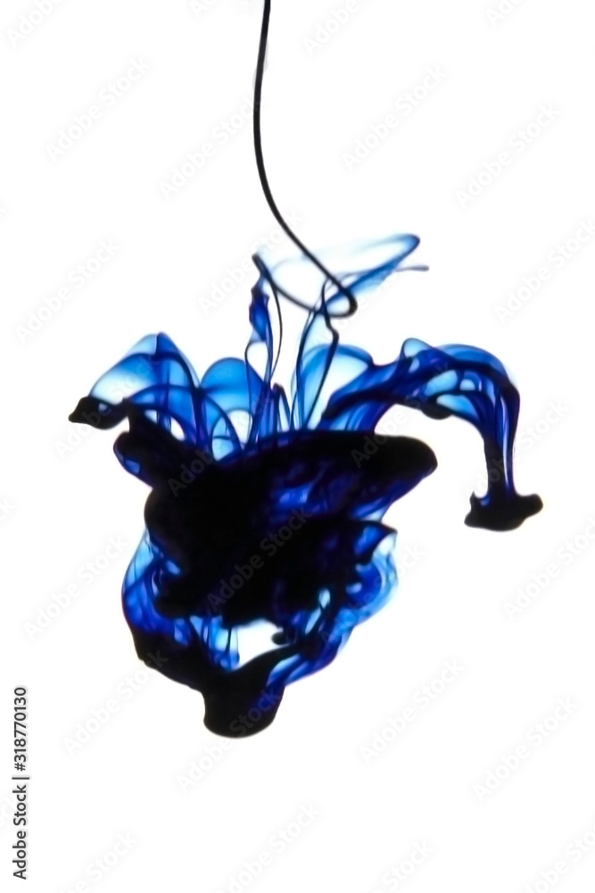 Acrylic colors and ink splashes dropped in water isolated on white