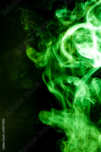 Green smoke motion on black background.