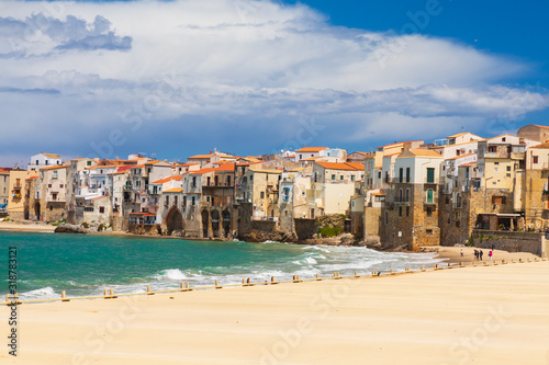 Italy, Sicily, Palermo Province, Cefalu. The beach on the Mediterranean Sea in the Sicilian town of Cefalu.
