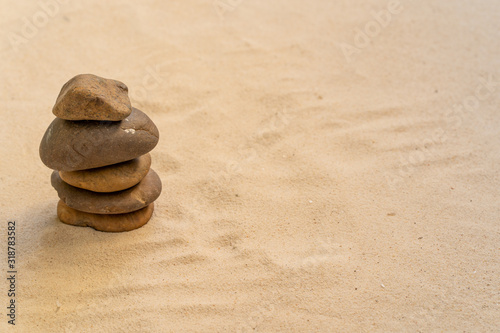 Concept of stacking stones on the beach.