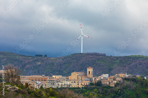 Italy, Sicily, Messina Province, Montalbano Elicona. Wind turbine on a hill above the town of Montalbano Elicona.