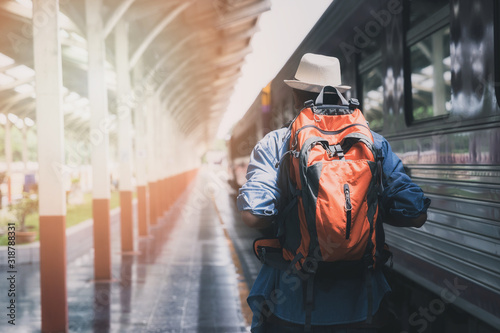 Fototapeta Naklejka Na Ścianę i Meble -  Traveler with backpack in train station. Travel concept.