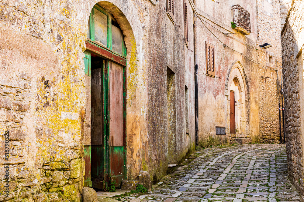 Italy, Sicily, Trapani Province, Erice. Narrow streets. Arched doorways.