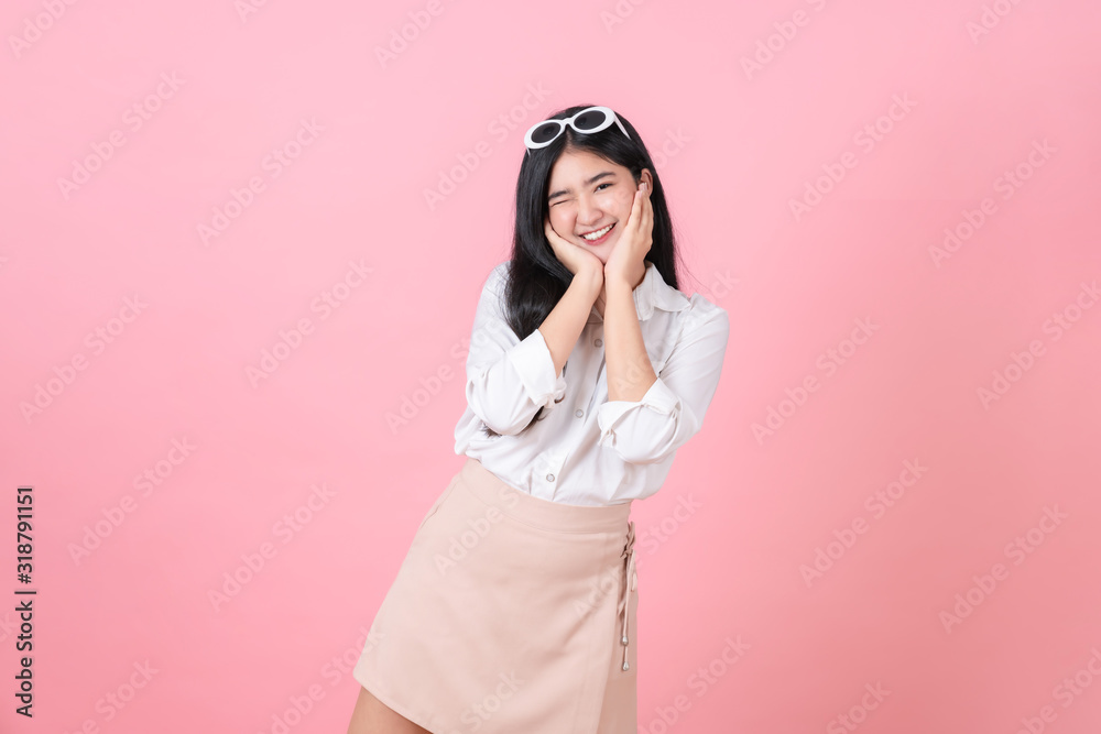 Happy attractive young Asian woman stand on pink background. Happy attractive young Asian woman stand on pink background.