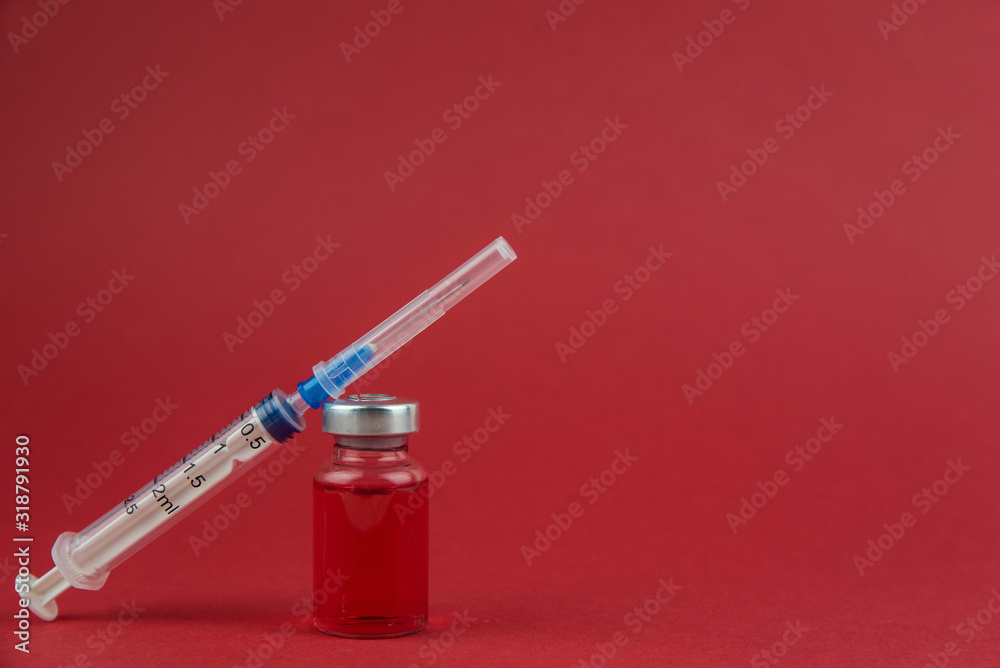 Medicine bottle for injection. Medical glass vials and syringe for vaccination. Liquid red drug or vaccine for treatment, flu in laboratory, hospital, healthcare, or pharmacy concept, isolated Medicine bottle for injection. Medical glass vials and syringe for vaccination. Liquid red drug or vaccine for treatment, flu in laboratory, hospital, healthcare, or pharmacy concept, isolated