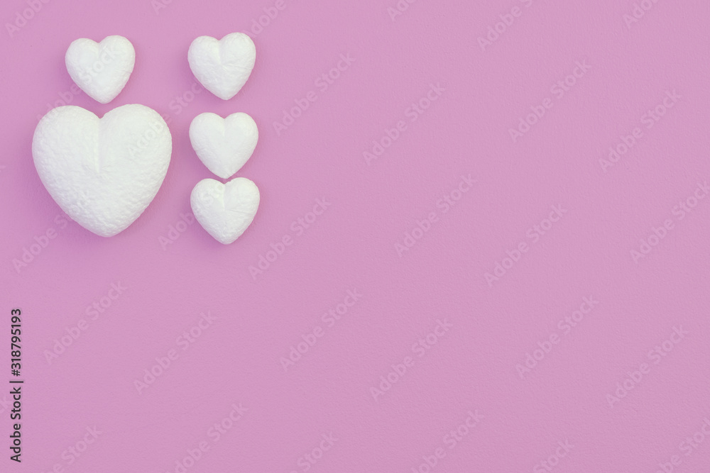 Love hearts on a pink background with a conceptual valentine's day